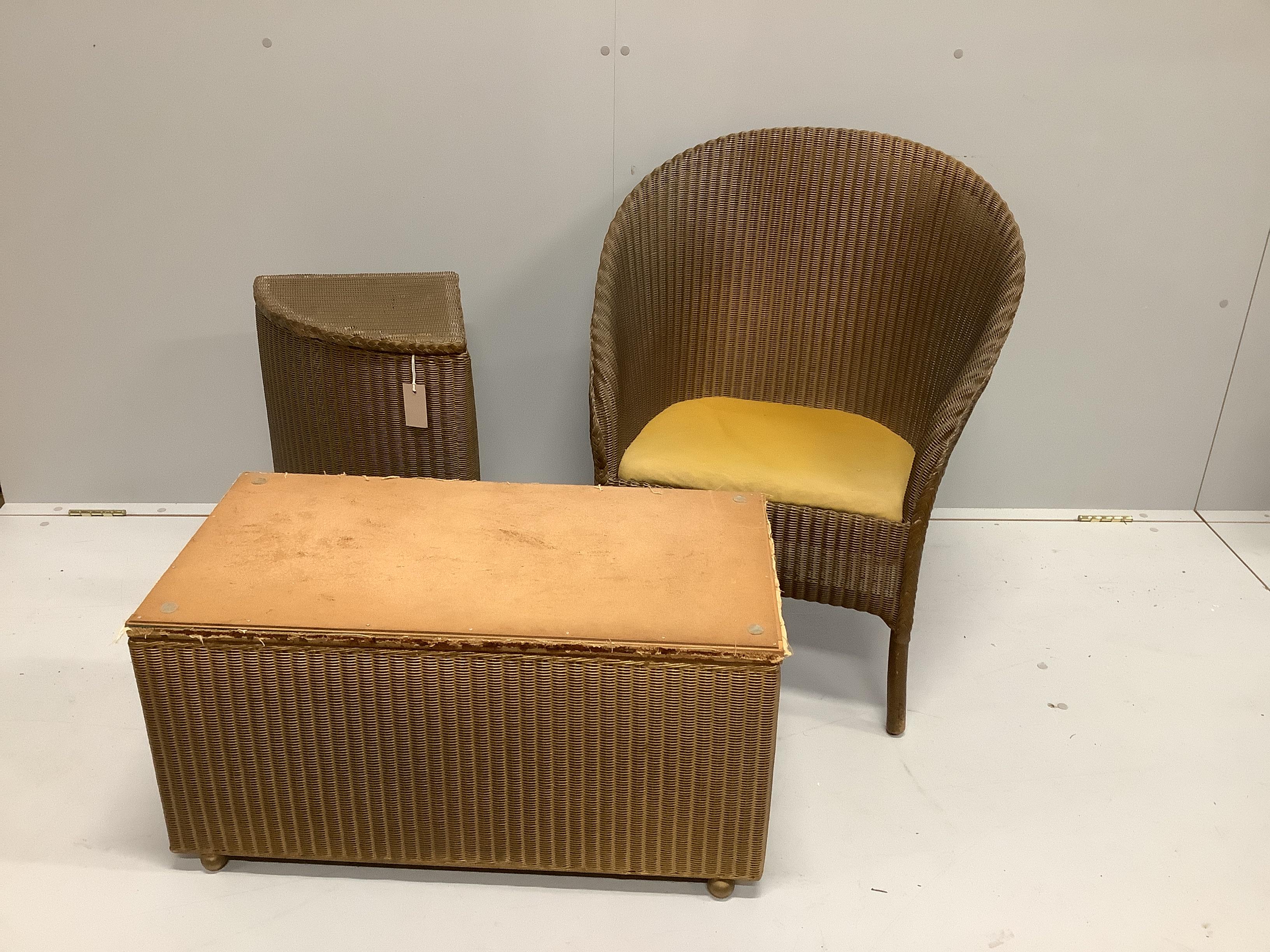 A Lloyd Loom chair, corner basket and ottoman